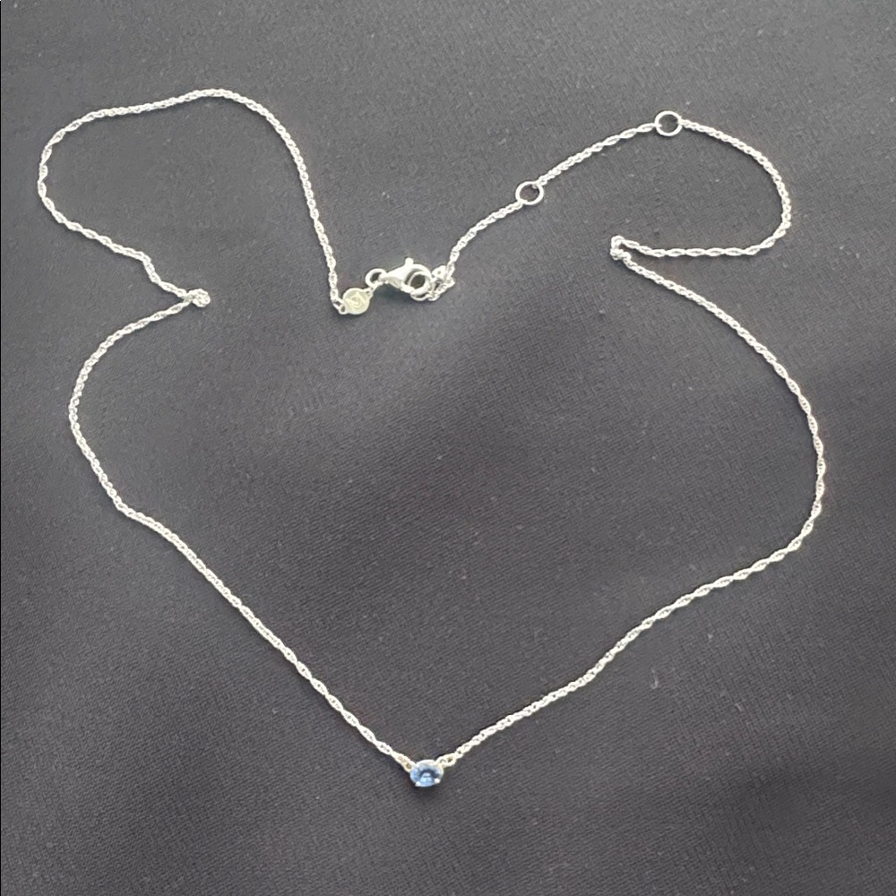 Melanie Casey white gold Centering Necklace with a blue sapphire